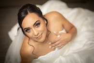 Stunning bridal portrait showcasing happiness and elegance in a classic wedding attire.